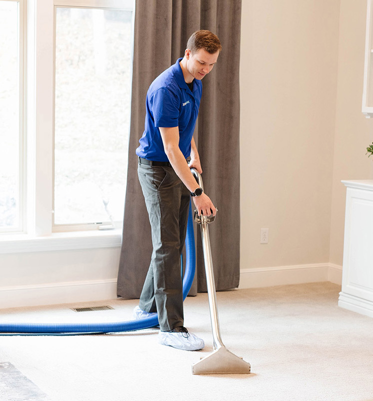 Zerorez cleaning a carpet with the latest carpet cleaning technology.
